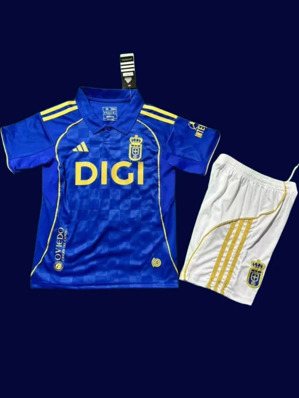 Real Oviedo Home Kids Kits 25/26 front with mini crest and child-friendly fit.
